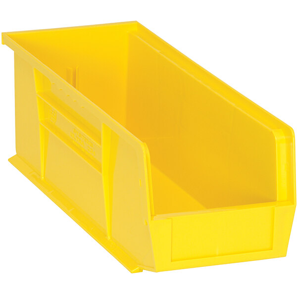 A yellow plastic Quantum hanging bin with a handle.