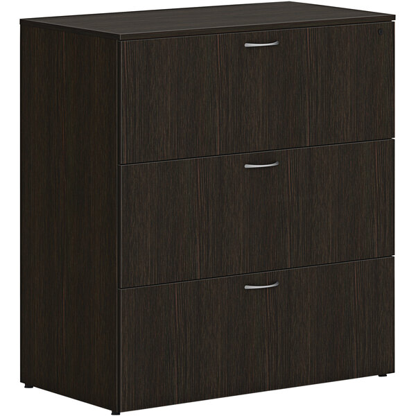 A Java oak HON lateral file cabinet with 3 drawers.