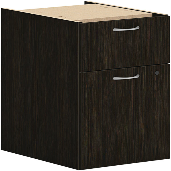 A black HON hanging pedestal with 1 file drawer and a white handle.