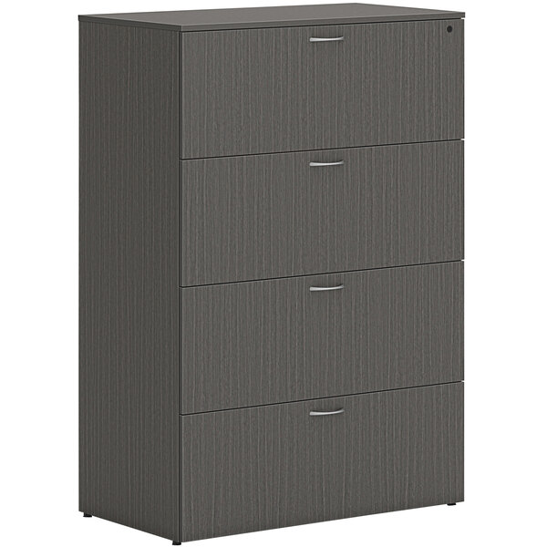 A slate grey HON lateral file cabinet with four drawers and silver handles.
