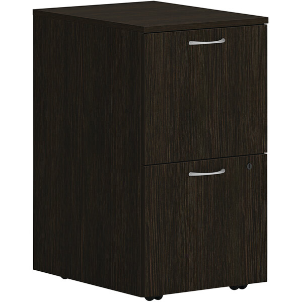 A java oak mobile pedestal with 2 file drawers and silver handles.
