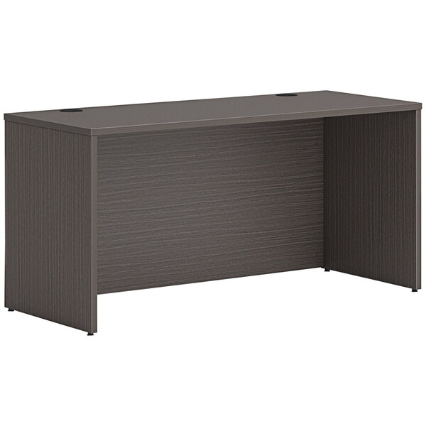 A gray HON credenza shell with a dark wood top.