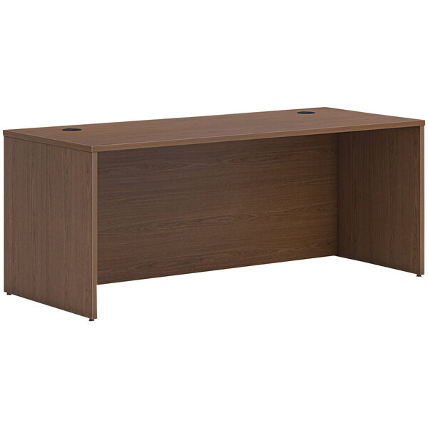 A brown HON Mod desk shell with a wooden top.
