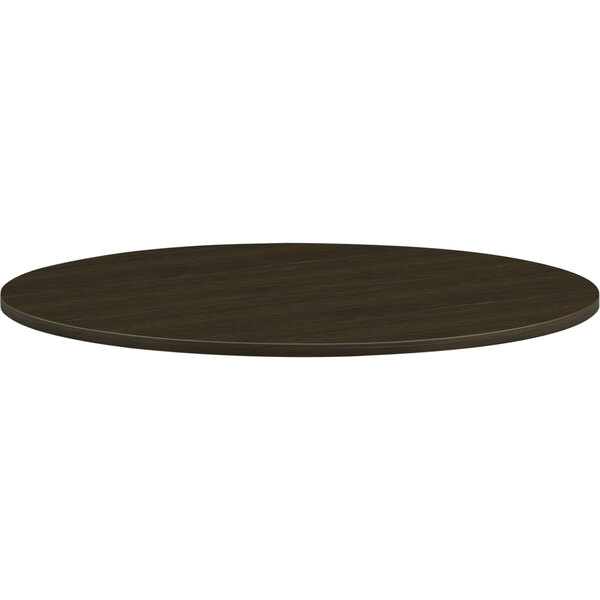 A HON Mod round conference table top in Java Oak.