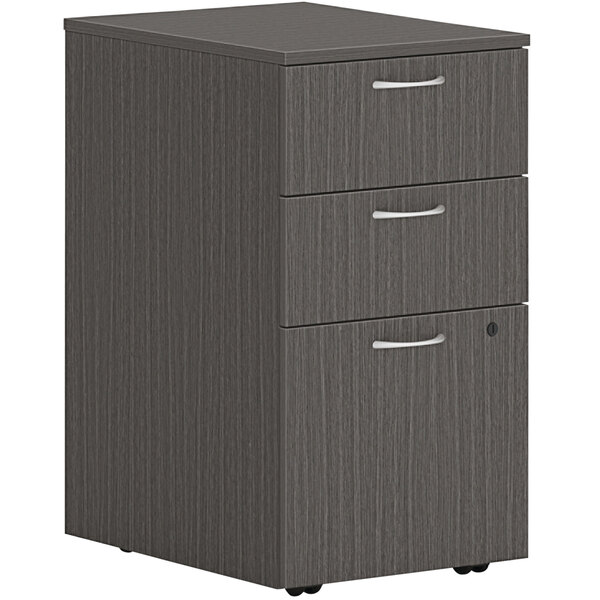 A slate grey HON mobile pedestal with 2 box drawers and 1 file drawer.