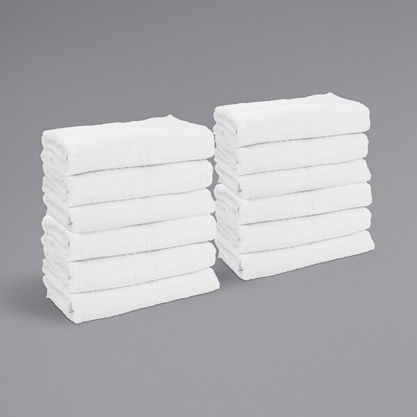 A stack of white Monarch Brands gym towels.