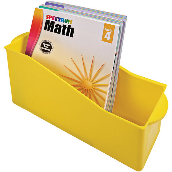 A yellow Deflecto kids book bin with books in it.