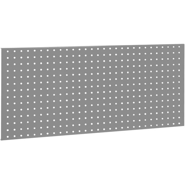 A gray steel BenchPro pegboard with holes in it.