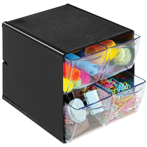 A black Deflecto stackable drawer organizer with a drawer full of stationery.