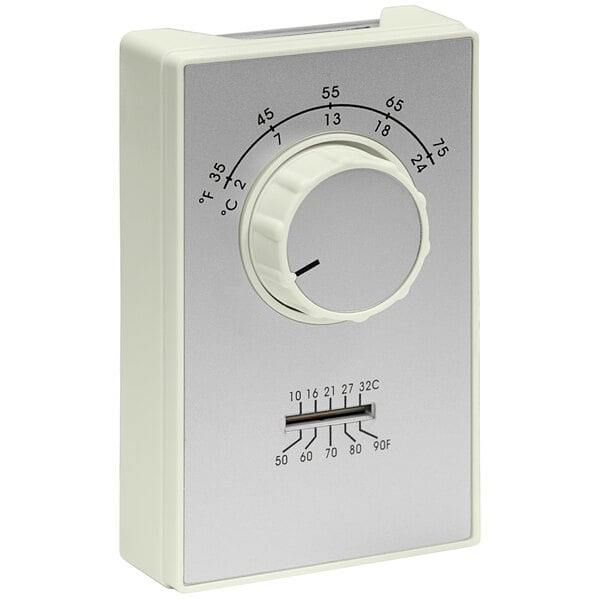A white TPI ET9 Series heating and cooling thermostat with a white and black dial.