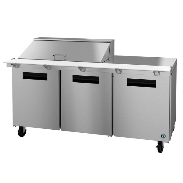 A stainless steel Hoshizaki commercial salad prep table with doors.