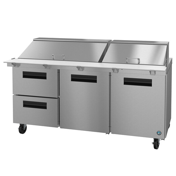 A Hoshizaki stainless steel refrigerated prep table with drawers.