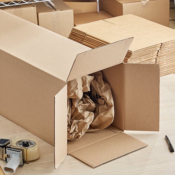 A Lavex Kraft cardboard shipping box with brown paper tape on it.
