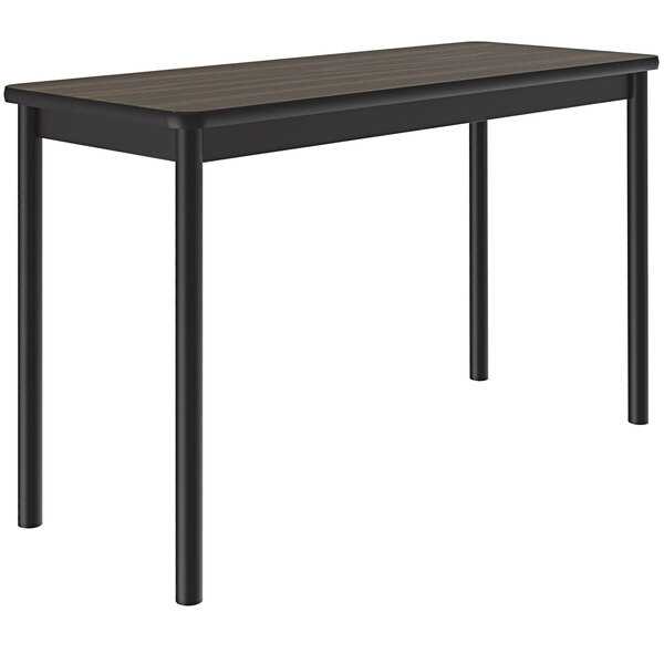 A Correll walnut lab table with black legs.