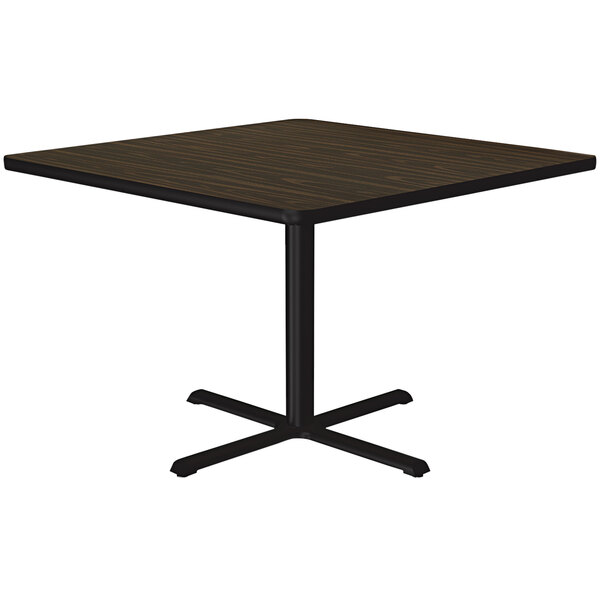 A Correll square table with a black base and a walnut finish top.