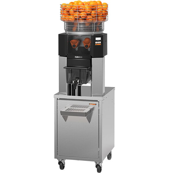 A Zummo commercial juicer with oranges in a metal basket on top.