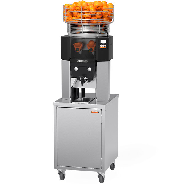 A Zummo commercial juicer with oranges in a metal basket.