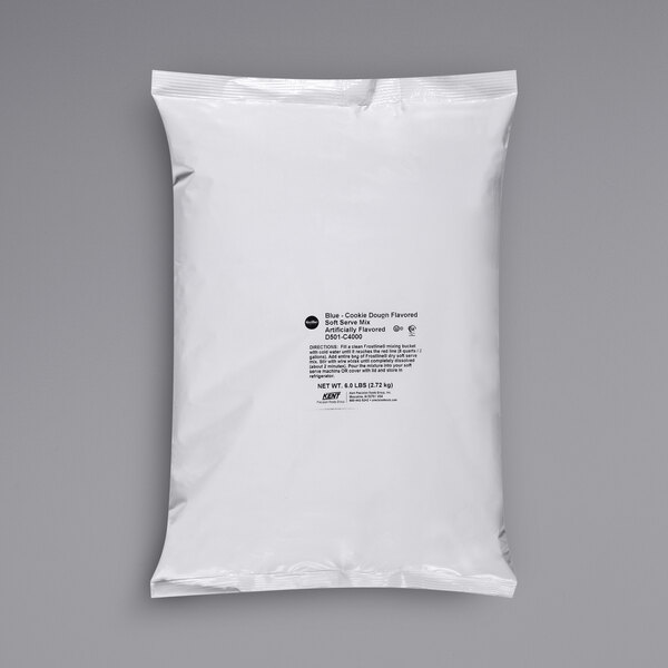 A white plastic bag of Frostline Blue Cookie Dough Soft Serve Mix with black text.