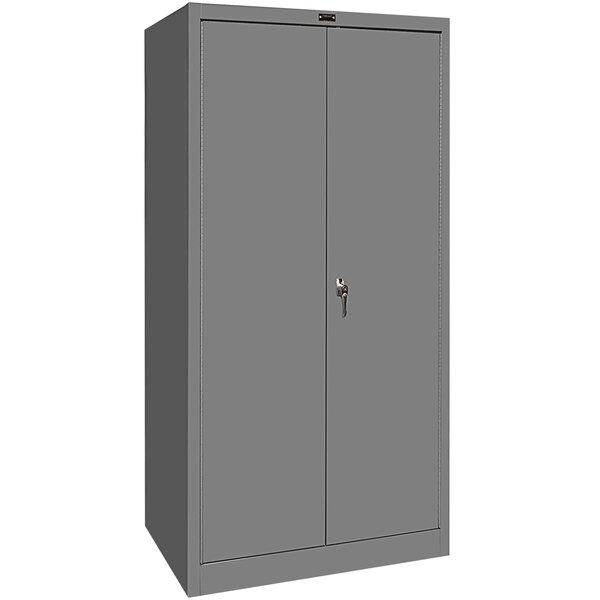A gray metal Hallowell wardrobe cabinet with solid doors.