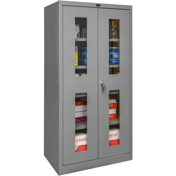 A Hallowell gray storage cabinet with safety-view doors on shelves.