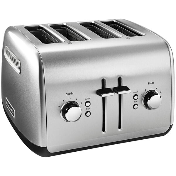 A silver KitchenAid 4-slice toaster on a professional kitchen counter.