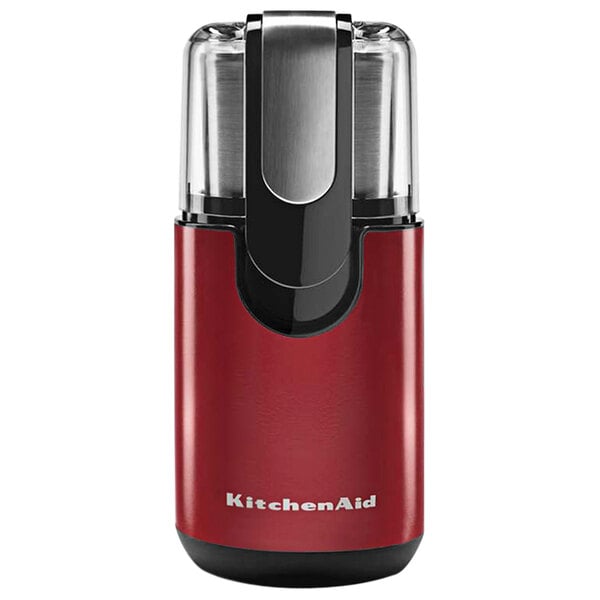 A close-up of a red KitchenAid coffee grinder with black accents.