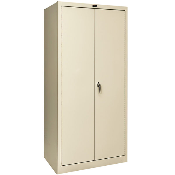 A tan Hallowell industrial storage cabinet with two solid doors.
