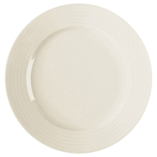 A white porcelain flat plate with a curved edge.