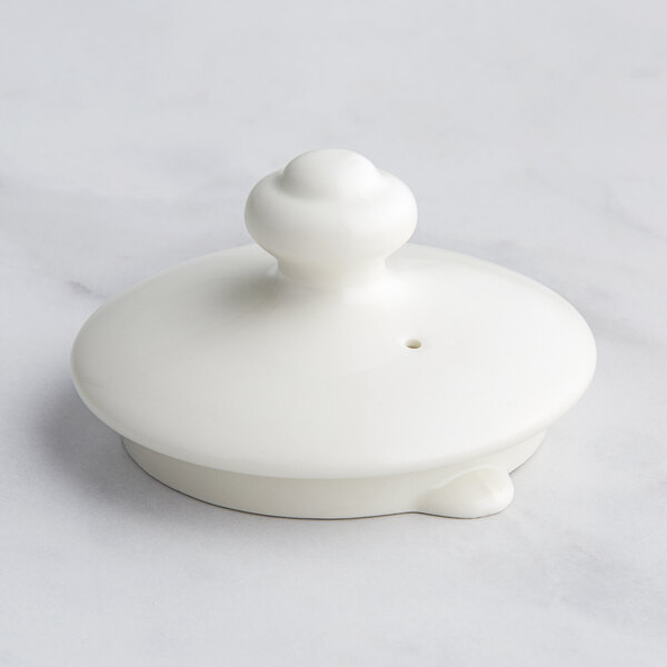 A white RAK Porcelain lid with a round top.