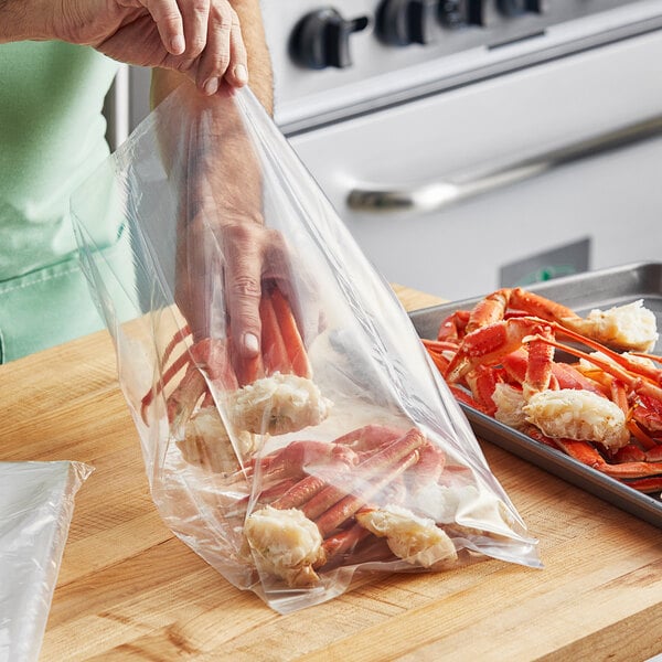 A person holding a Choice plastic bag of crab legs.