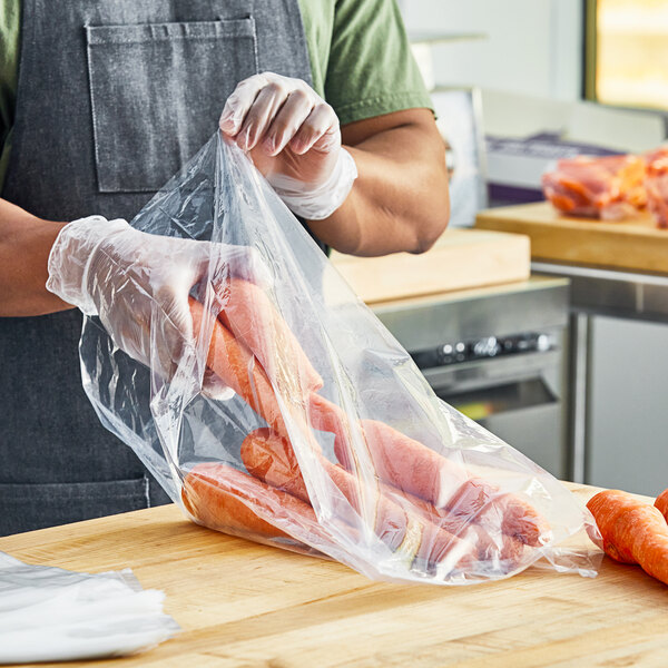 A person holding a Choice plastic bag of carrots.