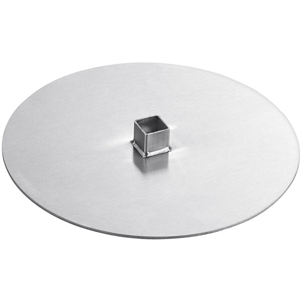A silver circular metal plate with a square hole in it.
