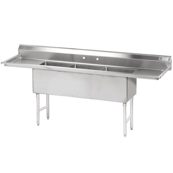 An Advance Tabco stainless steel three compartment pot sink with two drainboards.