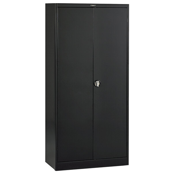 A black Tennsco storage cabinet with solid doors.