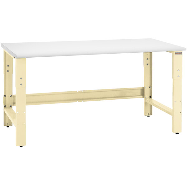A white workbench with a white rectangular top and beige legs.
