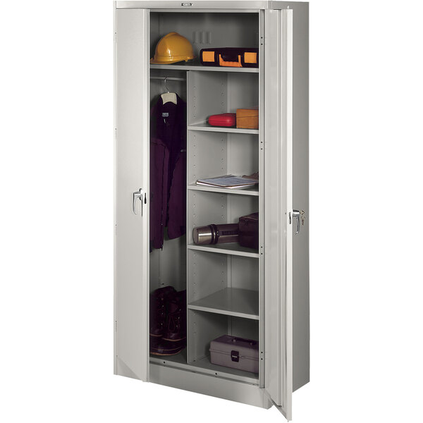 A light gray Tennsco metal combination cabinet with solid doors open.