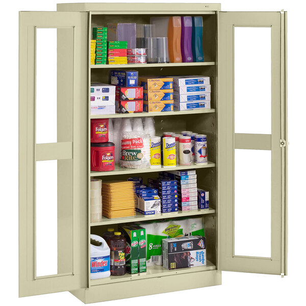 A Tennsco putty storage cabinet with C-Thru doors holding various items.