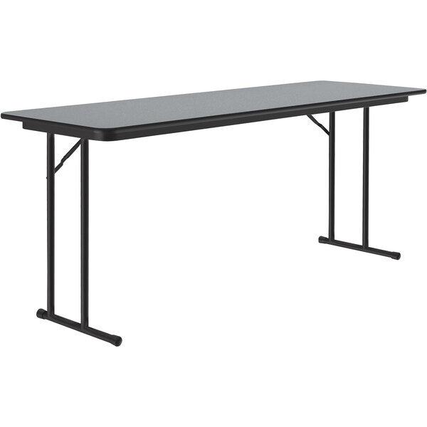 A Correll rectangular seminar table with a gray granite top and black legs.