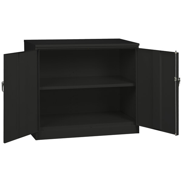 A black Tennsco jumbo storage cabinet with solid doors open.