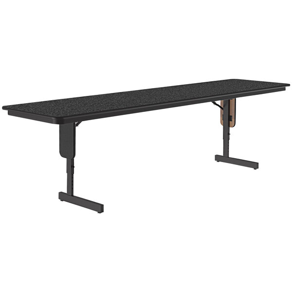 A black rectangular Correll seminar table with black panel legs and a black granite surface.