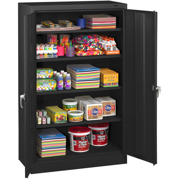 A black metal Tennsco storage cabinet with shelves full of items.