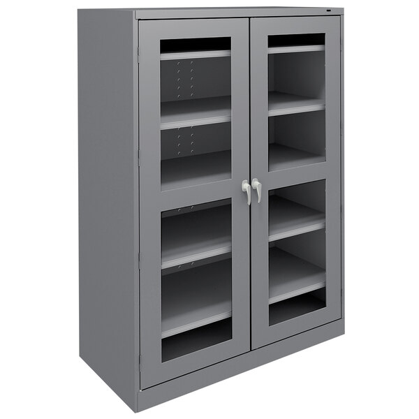 A dark grey metal Tennsco storage cabinet with C-Thru doors and shelves.