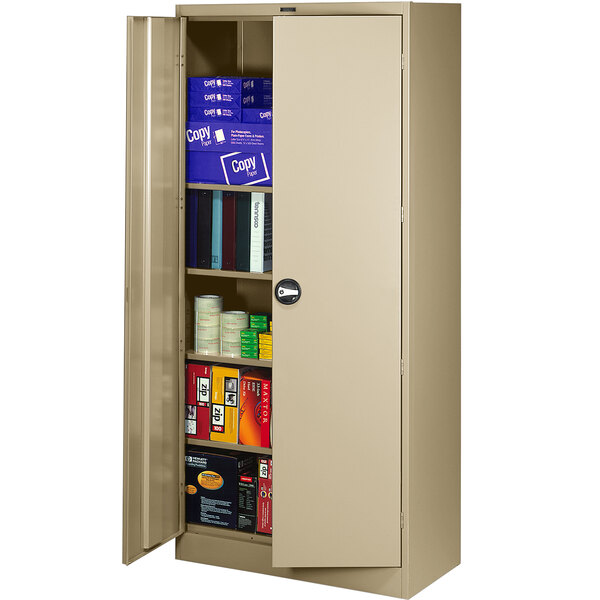 A tan metal Tennsco storage cabinet with shelves full of books.