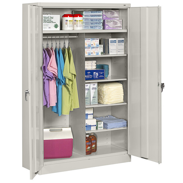 A light gray Tennsco jumbo combination cabinet with solid doors and items on the shelves.