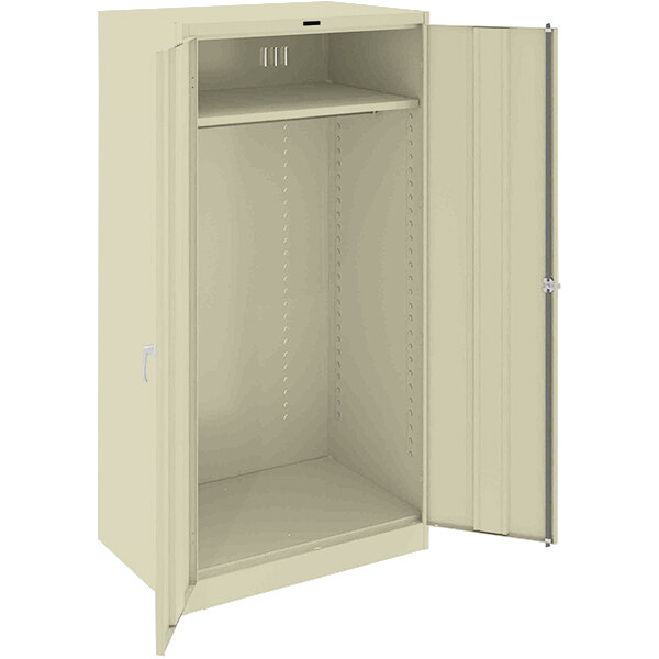 A white metal Tennsco wardrobe cabinet with open door.