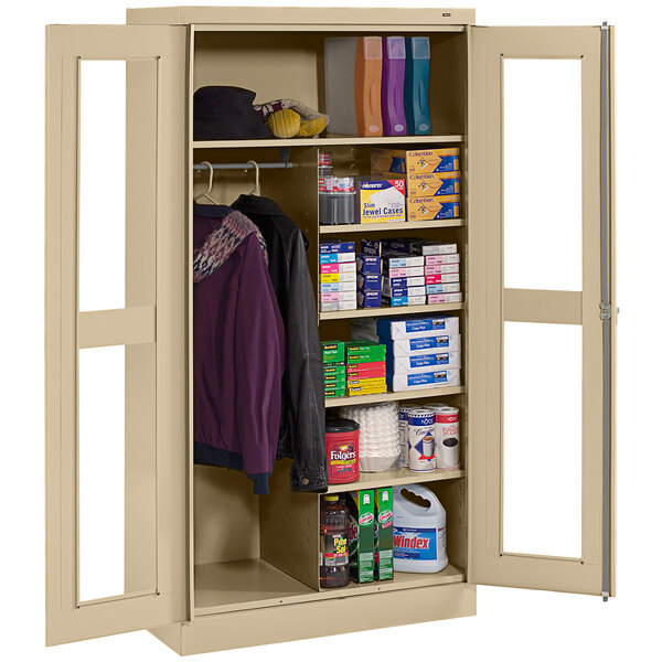 A sand-colored Tennsco combination cabinet with C-Thru doors and items on it.