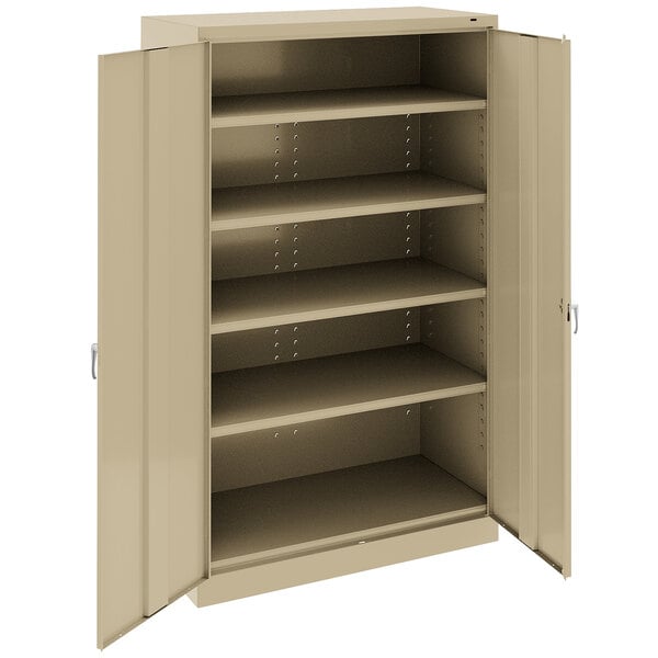 A tan Tennsco industrial storage cabinet with solid doors open.