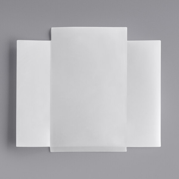 A white rectangular paper with a black border on a gray surface.