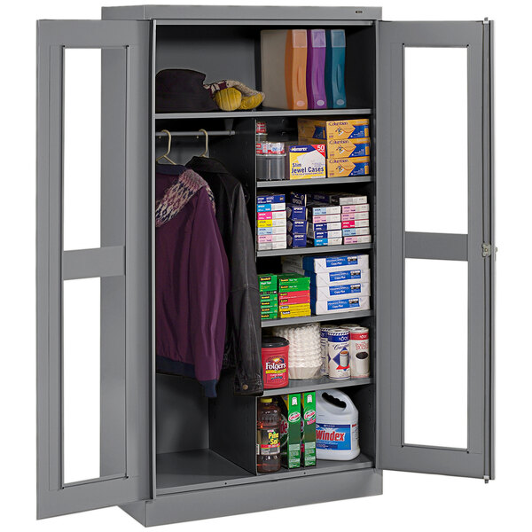 A dark gray metal Tennsco combination cabinet with open doors.