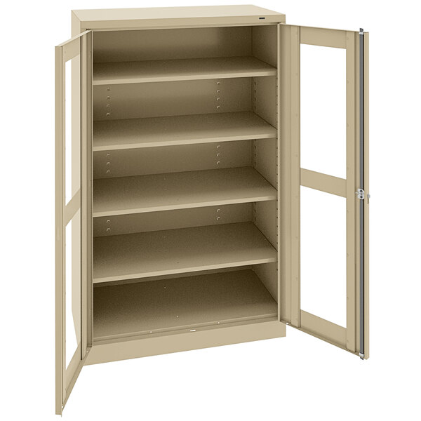A beige Tennsco metal storage cabinet with open doors.